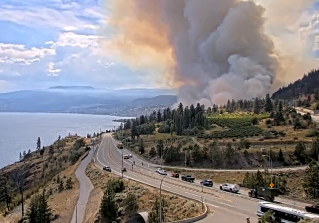 “Raging Wildfire Shuts Down Key Highway Near Kelowna, Sparks Emergency Alert”
